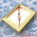Designer Diamond Studded Design Rakhi In Plastic Box Pkg.