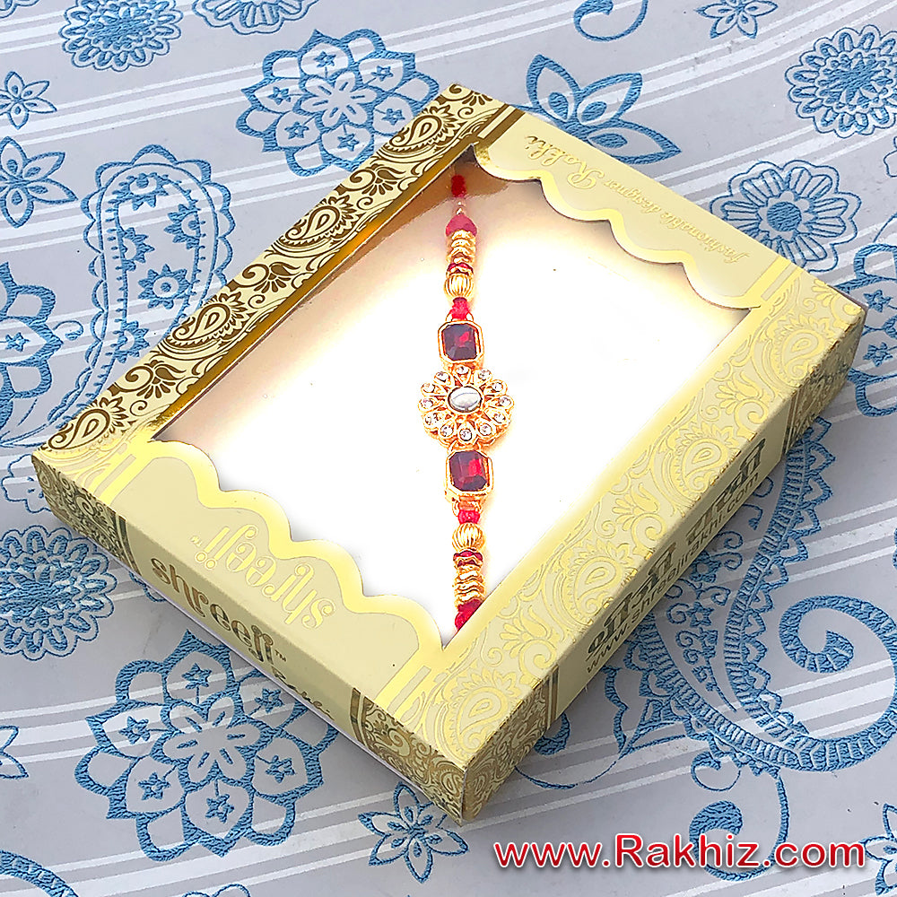 Designer Diamond Studded Design Rakhi In Plastic Box Pkg.